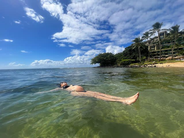 <p>Kourtney Kardashian Instagram</p> Kourtney Kardashian takes her baby bump for a swim during Hawaii beach day
