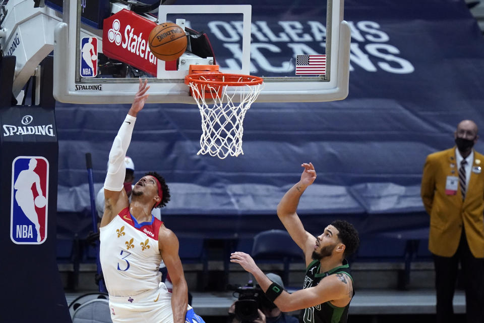 New Orleans Pelicans guard Josh Hart (3) goes to the basket against Boston Celtics forward Jayson Tatum (0) in the second half of an NBA basketball game in New Orleans, Sunday, Feb. 21, 2021. (AP Photo/Gerald Herbert)