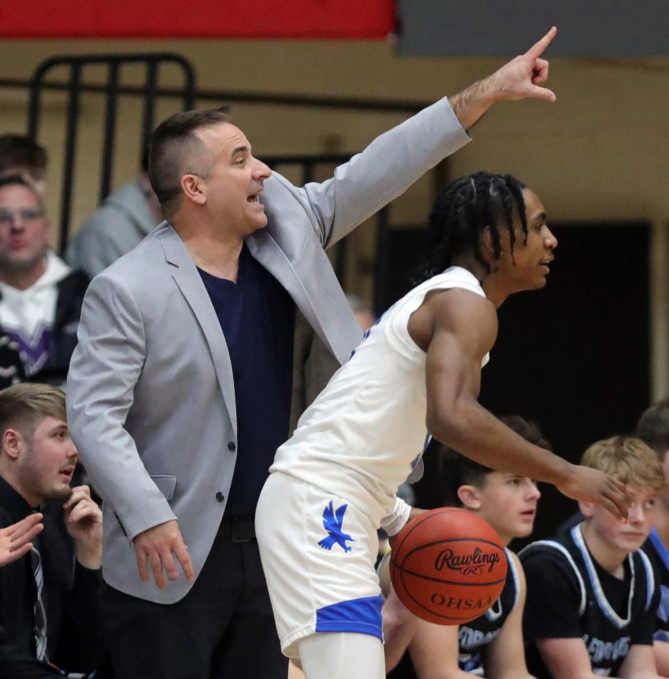 Louisville basketball coach Tom Siegfried calls out from the sideline during the first half of a basketball game in the Canton Play-By-Play Classic at Canton Memorial Field House, Saturday, Feb. 17, 2024, in Canton, Ohio.