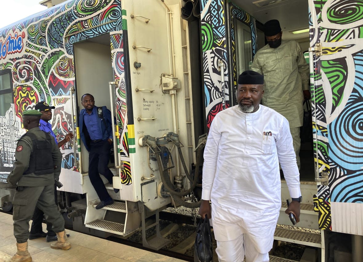 Passengers disembark from a train at the train station in Abuja, Nigeria, Monday, Dec. 5, 2022. (AP Photo/Chinedu Asadu)