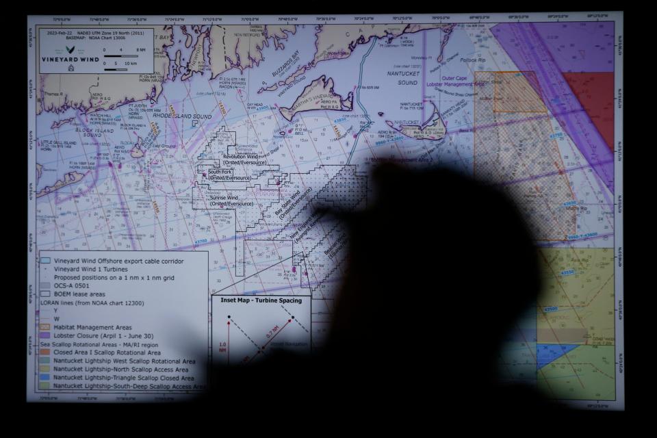 The chart of areas affected by offshore wind are shown on a TV during an event held at the New Bedford Port Authority building in New Bedford where fishermen could enroll in the Vineyard Wind Fisheries Compensation Program.