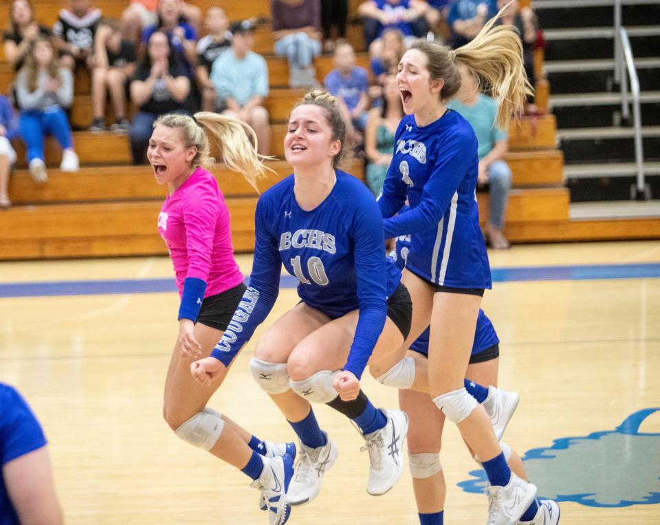 Members of the Barron Collier volleyball team celebrate a big point over Osceola in the Class 5A regional final at Barron Collier High School on Saturday, Nov. 6, 2021. Barron Collier would go on to win and moves on to the state semifinals on Nov. 13.