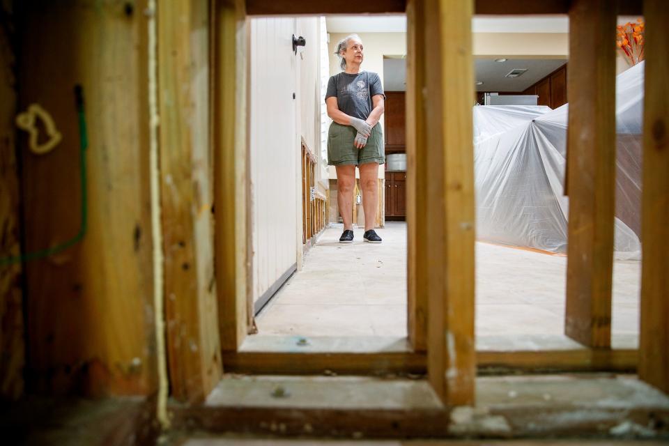 Lydia Duran, 68, stands inside her storm-damaged condo in the Spanish Walk neighborhood in Palm Desert on Sept. 18.