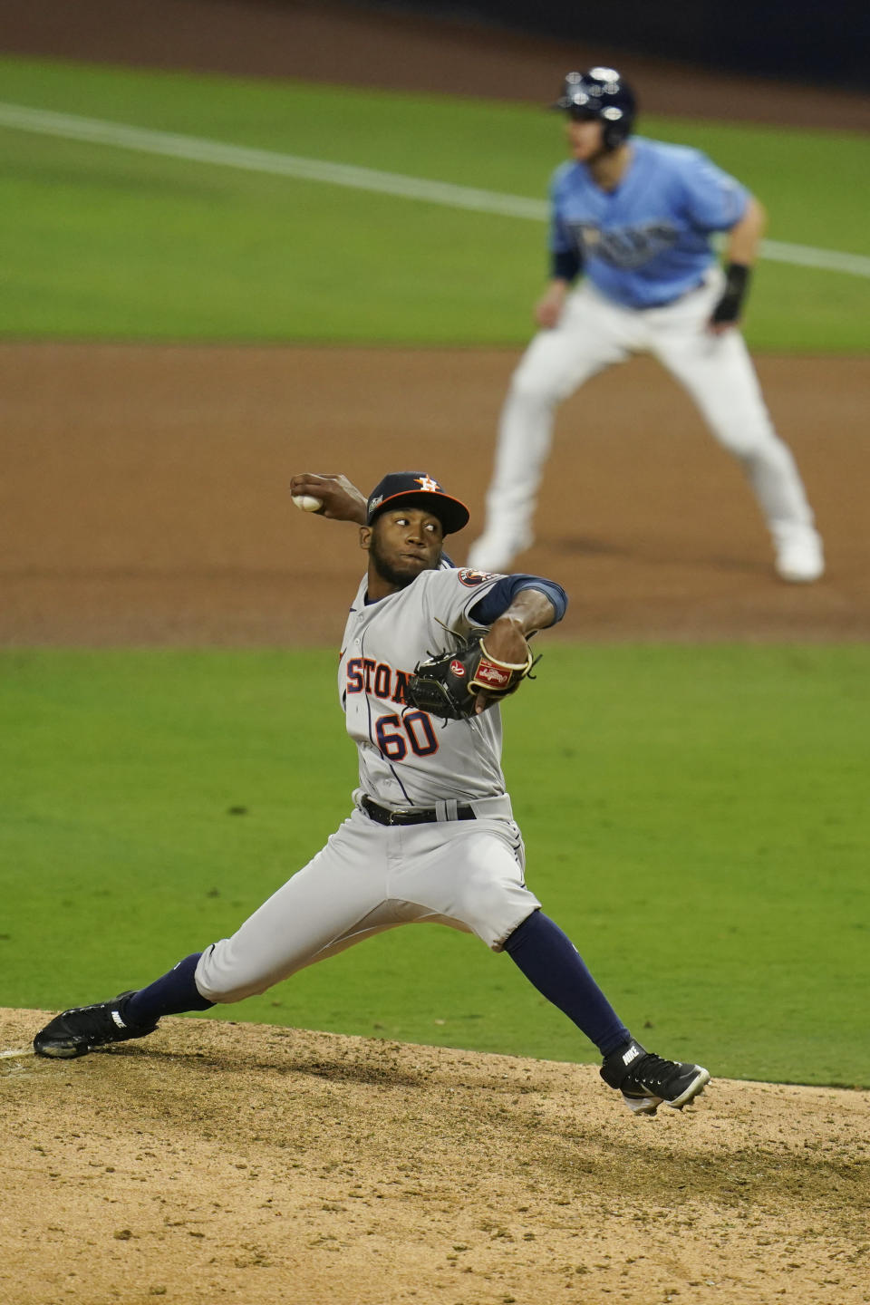 Houston Astros pitcher Enoli Paredes throws during the seventh inning in Game 1 of a baseball American League Championship Series against the Houston Astros, Sunday, Oct. 11, 2020, in San Diego. (AP Photo/Gregory Bull)