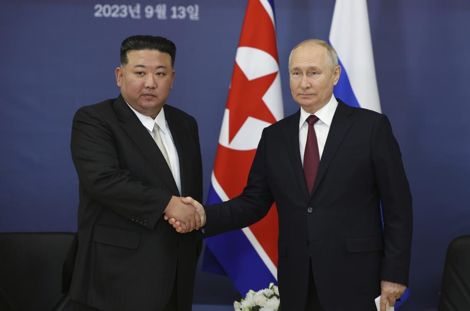 FILE - Russian President Vladimir Putin, right, and North Korea's leader Kim Jong Un shake hands during their meeting at the Vostochny cosmodrome outside the city of Tsiolkovsky, about 200 kilometers (125 miles) from the city of Blagoveshchensk in the far eastern Amur region, Russia, on Sept. 13, 2023. Even for a nation that has perfected the provocative, North Korean leader Kim Jong Un’s declaration that he would abandon the existential goal of reconciling with rival South Korea was a shock. But a closer look shows it’s the almost inevitable culmination of years of building tension. (Vladimir Smirnov, Sputnik, Kremlin Pool Photo via AP, File)