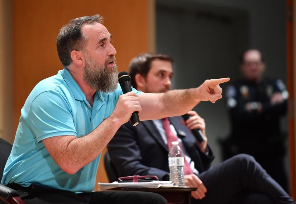 Recently appointed trustees of New College of Florida, Jason "Eddie" Speir answers a question from a student during a public meeting with students Wednesday afternoon on campus.  