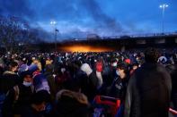 French gendarmes evacuate makeshift migrant camp in the outskirts of Paris