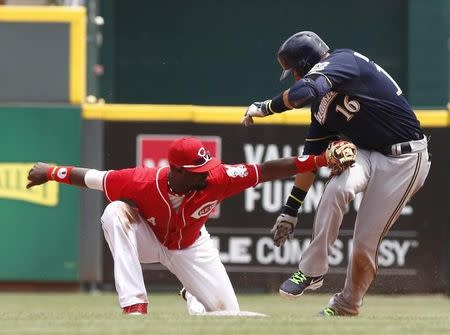 Milwaukee Brewers third baseman Aramis Ramirez (16) is tagged out at second base by Cincinnati Reds second baseman Brandon Phillips (4) during the fifth inning at Great American Ball Park. Jul 6, 2014; Cincinnati, OH, USA;David Kohl-USA TODAY Sports