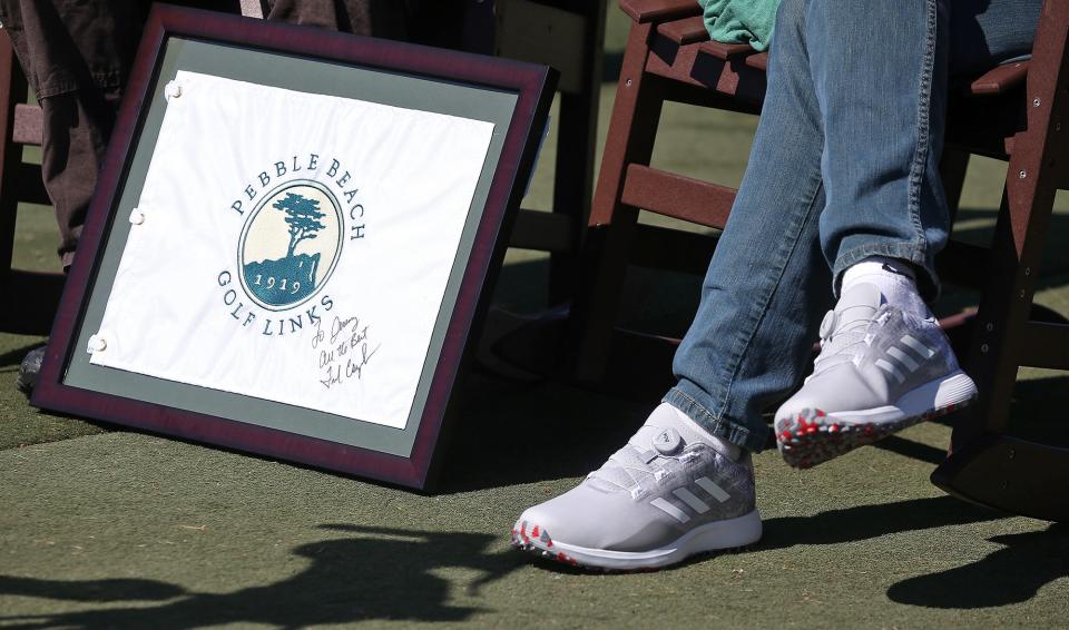 Jeremy shows off his Fred Couples autograph at Firestone Country Club on Tuesday.