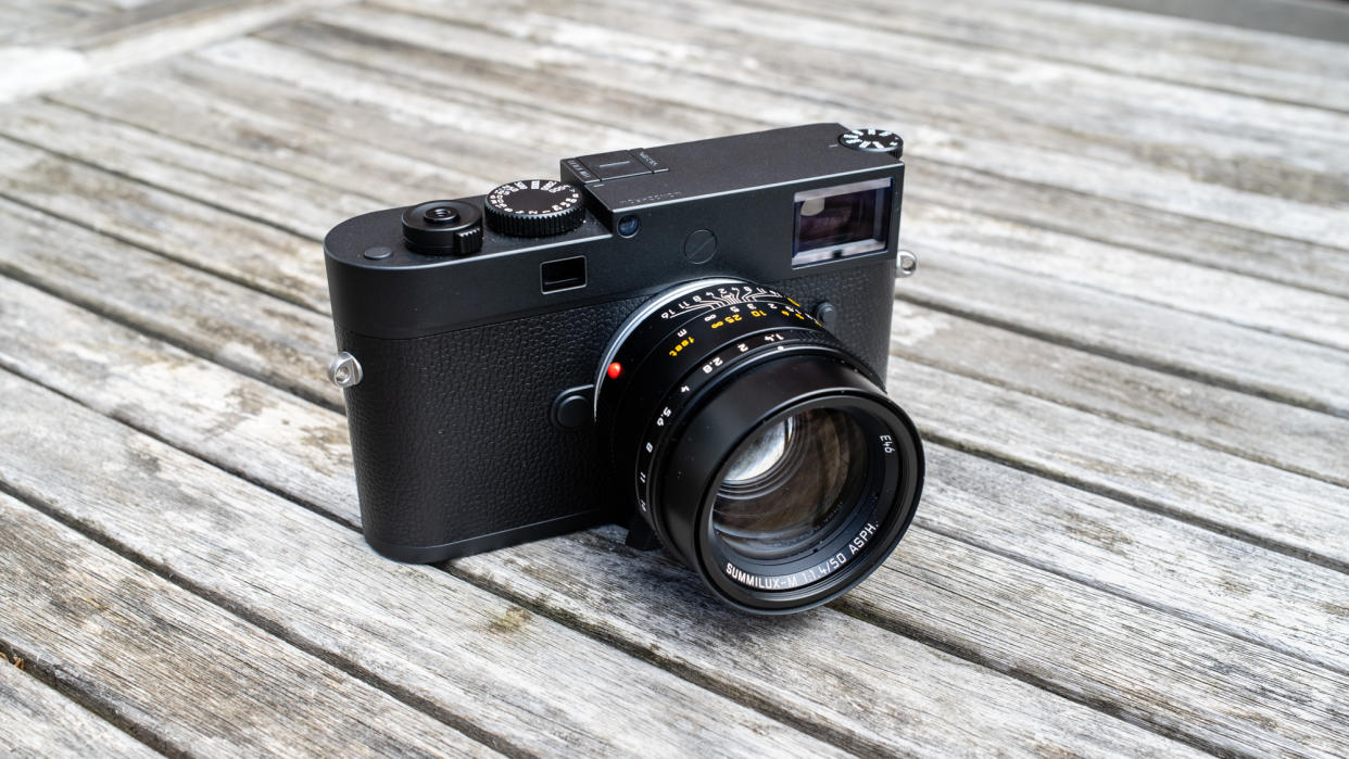  Leica M11 Monochrom and Leica Summilux-M 50mm f/1.4 ASPH II on a wooden table 