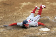 Washington Nationals' Andrew Stevenson scores on a sacrifice fly by Trea Turner during the 10th inning of the team's baseball game against the New York Yankees Saturday, May 8, 2021, at Yankee Stadium in New York. The Yankees won 4-3 in 11 innings. (AP Photo/Bill Kostroun)