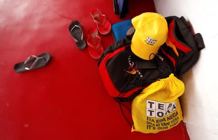 The bags, hats and flip flops of Papua New Guinea table tennis players can be seen against a wall during a practice session at a Beijing-funded facility in central Port Moresby in Papua New Guinea, November 19, 2018. REUTERS/David Gray