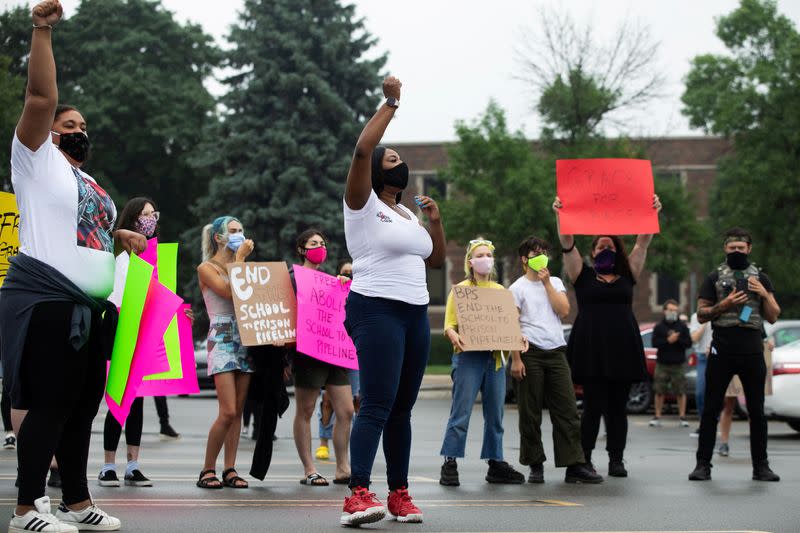 Students protest outside Groves High School in support of a fellow student who was jailed in a Detroit suburb