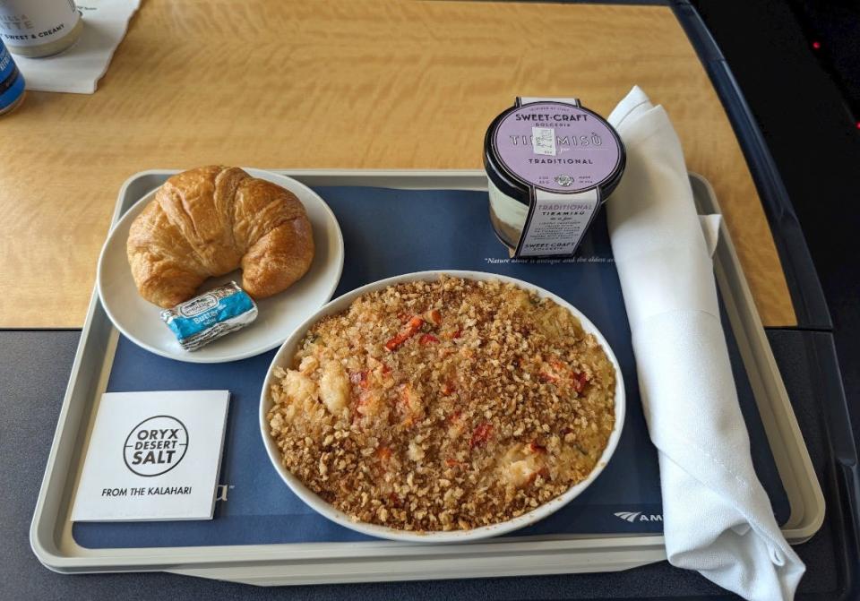 Lobster mac and cheese, yogurt, and croissant on Amtrak table 