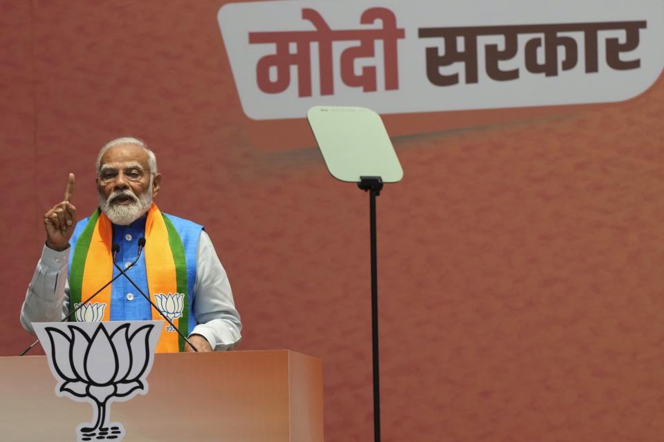 Indian Prime Minister Narendra Modi speaks at an event during which he released his ruling Bharatiya Janata Party's manifesto for the upcoming national parliamentary elections in New Delhi, India, Sunday, April 14, 2024. (AP Photo/Manish Swarup)