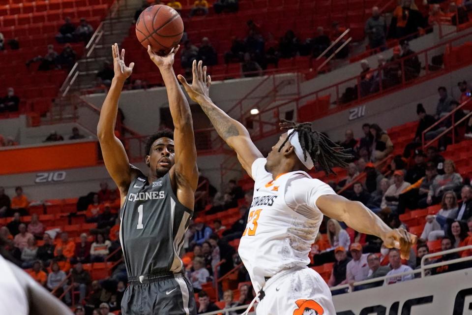 Iowa State's Izaiah Brockington (1) shoots over Oklahoma State's Tyreek Smith in the first half of Wednesday's Big 12 game at Gallagher-Iba Arena in Stillwater.