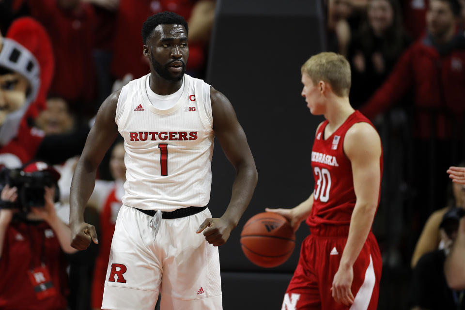 Rutgers forward Akwasi Yeboah (1) reacts after making a basket in front of Nebraska guard Charlie Easley (30) during the first half of an NCAA college basketball game Saturday, Jan. 25, 2020, in Piscataway, N.J. (AP Photo/Adam Hunger)