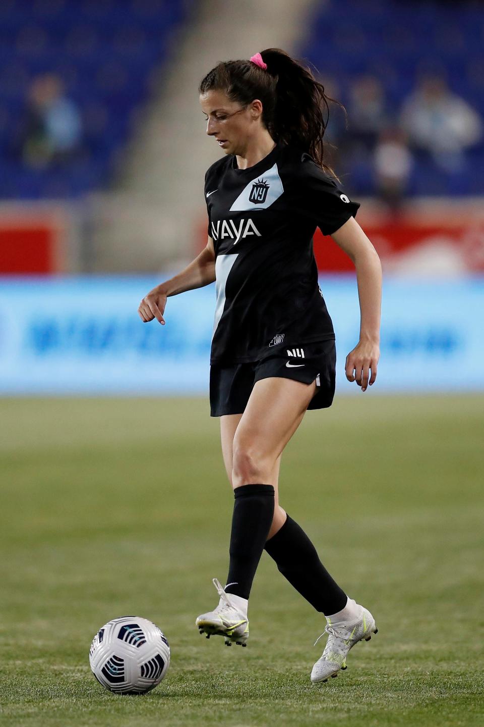 Gotham FC forward Paige Monaghan (4) moves the ball up the pitch during the second half of an NWSL soccer match against the Houston Dash, Saturday, May 15, 2021, in Harrison, N.J. Gotham FC won 1-0. (AP Photo/Steve Luciano)