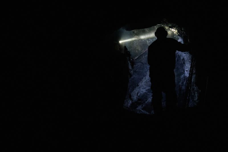 FILE PHOTO: Workers drill into anthracite coal in a drift mine in Pottsville, Pennsylvania,