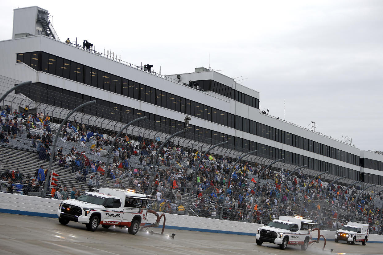 DOVER, DELAWARE - MAY 01: The NASCAR Track Drying Team works to dry the track during a rain delay in the NASCAR Cup Series DuraMAX Drydene 400 presented by RelaDyne at Dover Motor Speedway on May 01, 2022 in Dover, Delaware. (Photo by Sean Gardner/Getty Images)