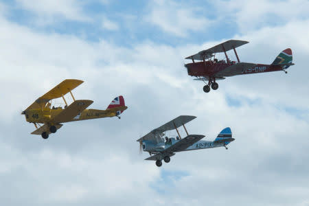 Biplanes representing Britain, Botswana and South Africa fly during the start of the Vintage Air Rally over the airport of Sitia on the island of Crete, Greece, November 11, 2016. Vintage Air Rally/Beatrice de Smet/Handout via REUTERS