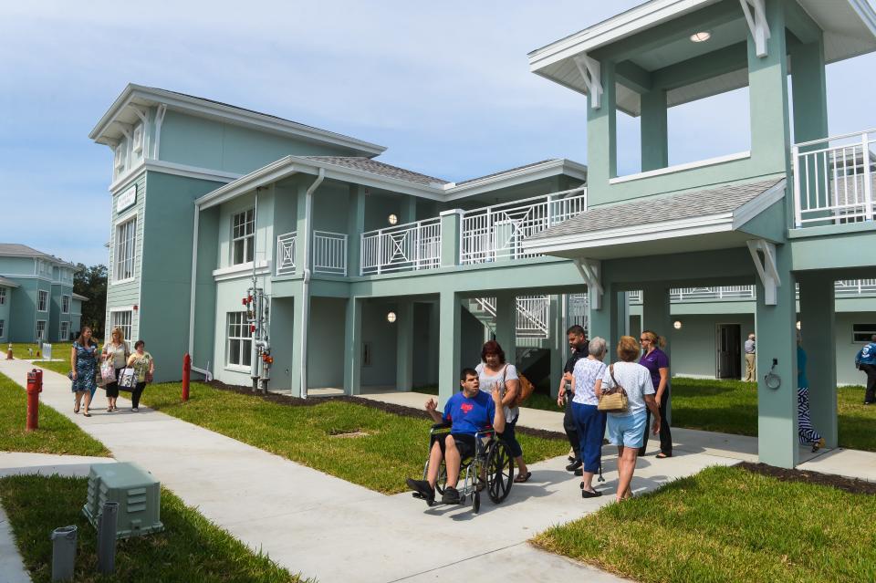 Potential residents, families and community supporters tour the Loveland Village in Venice after a ribbon cutting ceremony in 2016. The apartment complex offers a safe and affordable place for adults with intellectual and developmental disabilities.
