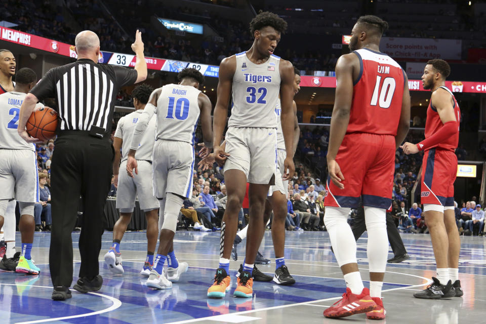 Memphis' James Wiseman (32) take his position on the floor during the second half of an NCAA college basketball game against Illinois-Chicago, Friday, Nov. 8, 2019, in Memphis, Tenn. (AP Photo/Karen Pulfer Focht)