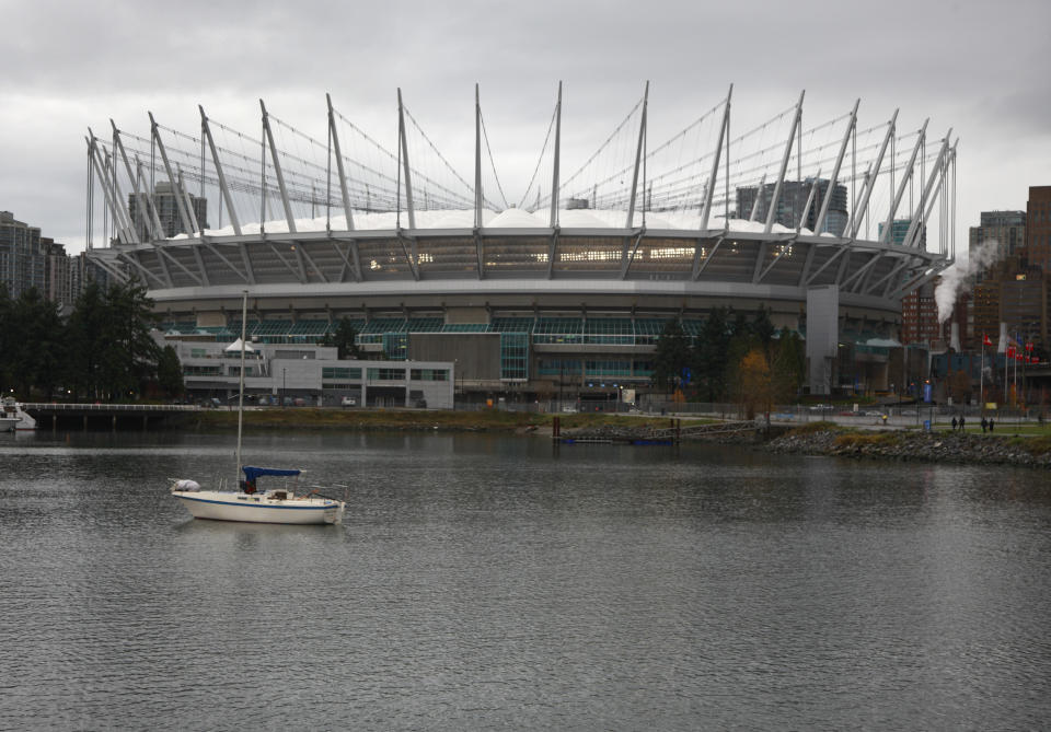 VANCOUVER, CANADA - NOVEMBER 27: A boat sits idle in False Creek in front of BC Place where the 99th Grey Cup between the Winnipeg Blue Bombers and the BC Lions is being played November 27, 2011 in Vancouver, British Columbia, Canada. (Photo by Jeff Vinnick/Getty Images)