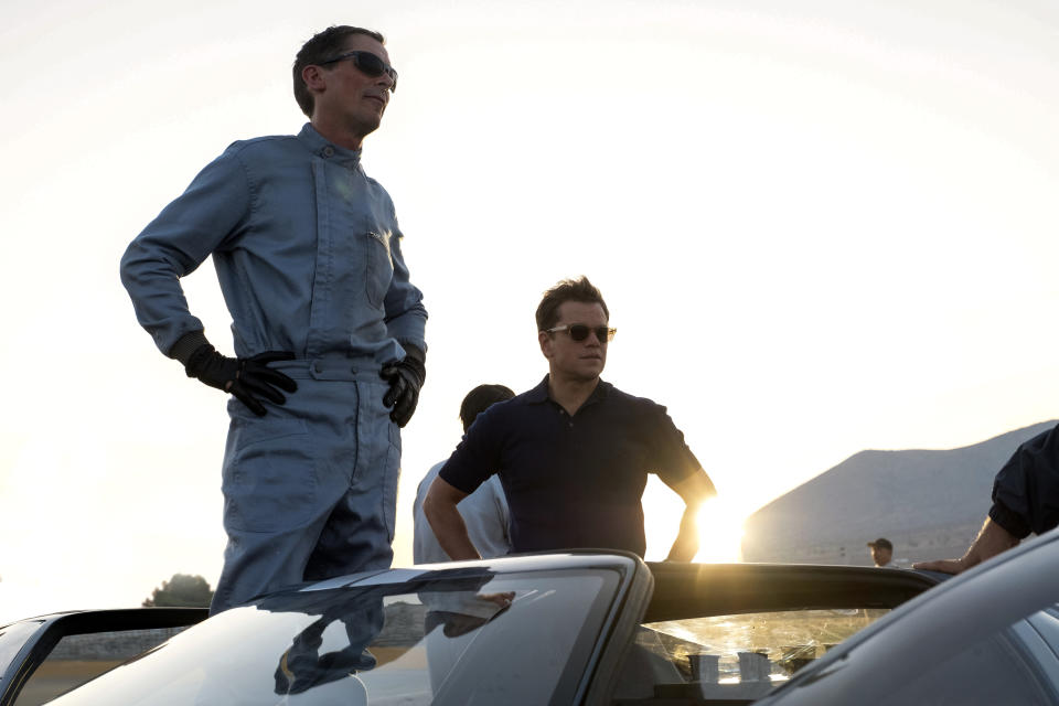 This image released by 20th Century fox shows Christian Bale, left, and Matt Damon in a scene from "Ford v. Ferrari," in theaters on Nov. 15. (Merrick Morton/20th Century Fox via AP)