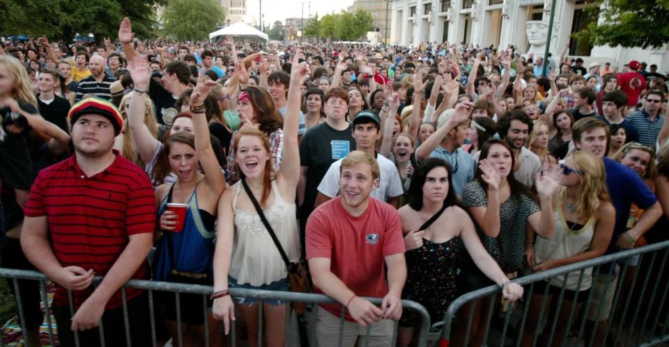 The crowd at Scene - TV5MONDE cheers as Radio Radio performs in downtown Lafayette, La., on April 27, 2012.