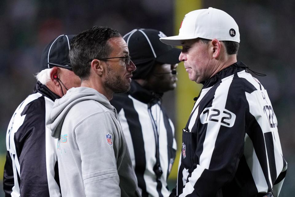 Miami Dolphins head coach Mike McDaniel speaks with officials during the second half of an NFL football game against the Philadelphia Eagles on Sunday, Oct. 22, 2023, in Philadelphia. (AP Photo/Matt Rourke)