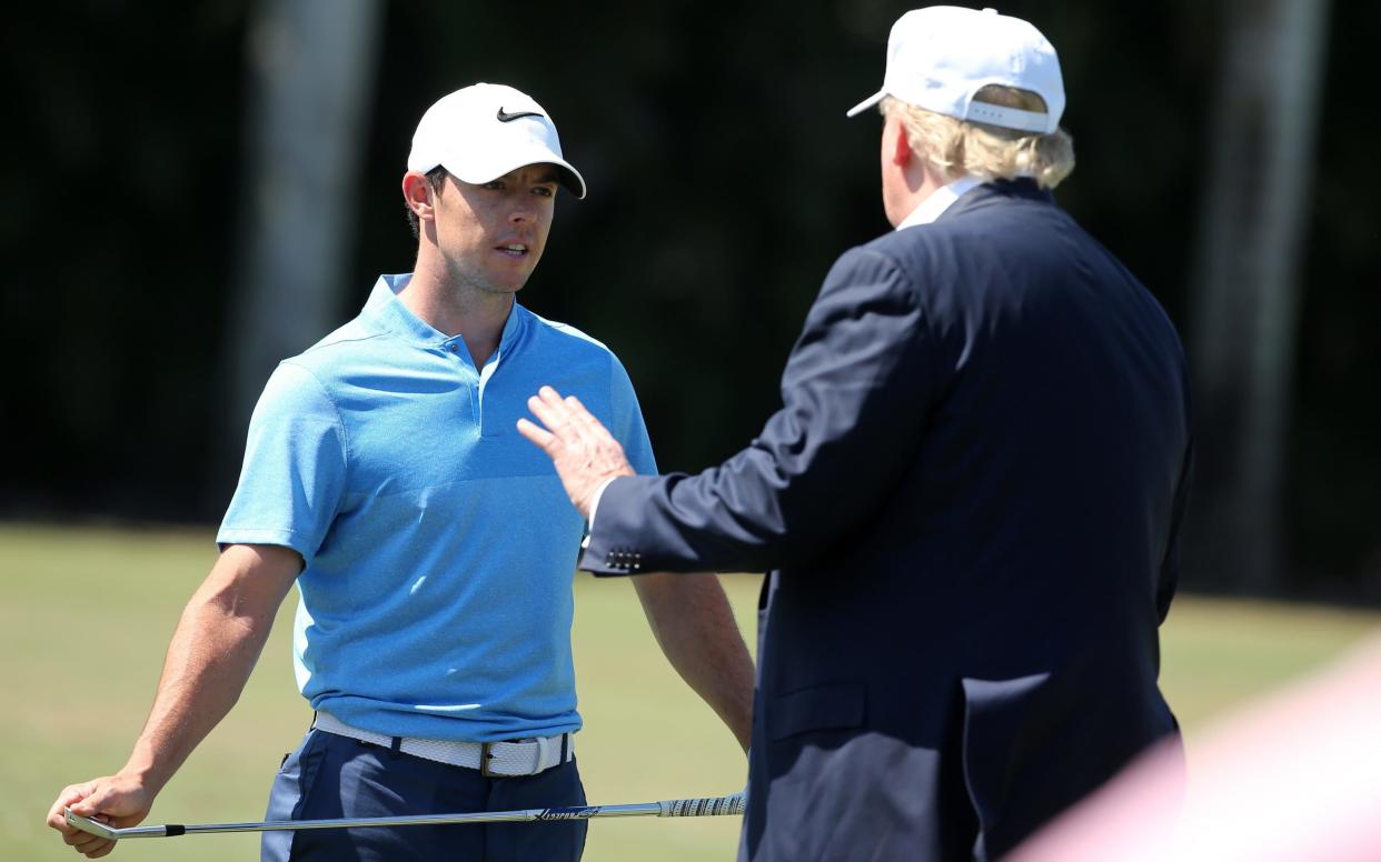 Donald Trump speaks with Rory McIlroy during the final round of the World Golf Championships-Cadillac Championship at Trump National Doral Blue Monster Course in March 2016 - 2016 Getty Images