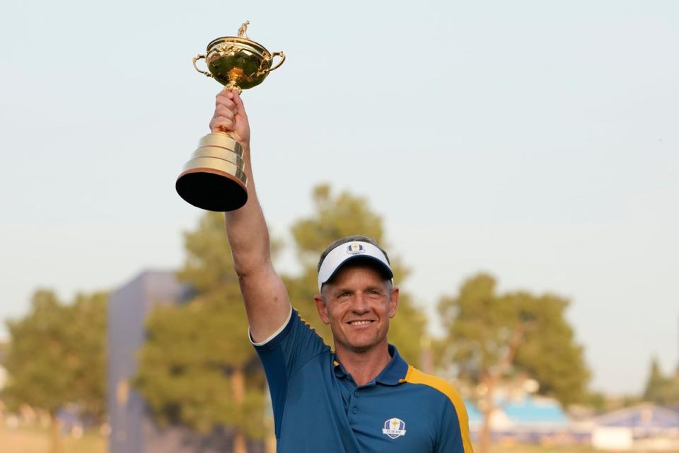 Luke Donald lifts the Ryder Cup. He hasn’t ruled out accepting a convention-breaking second captaincy (Copyright 2023 The Associated Press. All rights reserved)