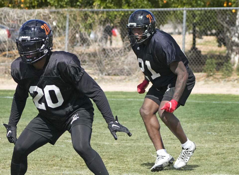 Mar 8, 2024; mesa, Ariz, U.S.; Arizona Rattlers Jaylen Perkins, (20) DB, and Rashie Hodge, (21), DB perform a drill during practice at Gene Autry Park complex. Mandatory Credit: Cheryl Evans-Arizona Republic