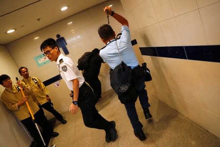 Police chase a flashmob inside Hong Kong International Airport, Hong Kong, China