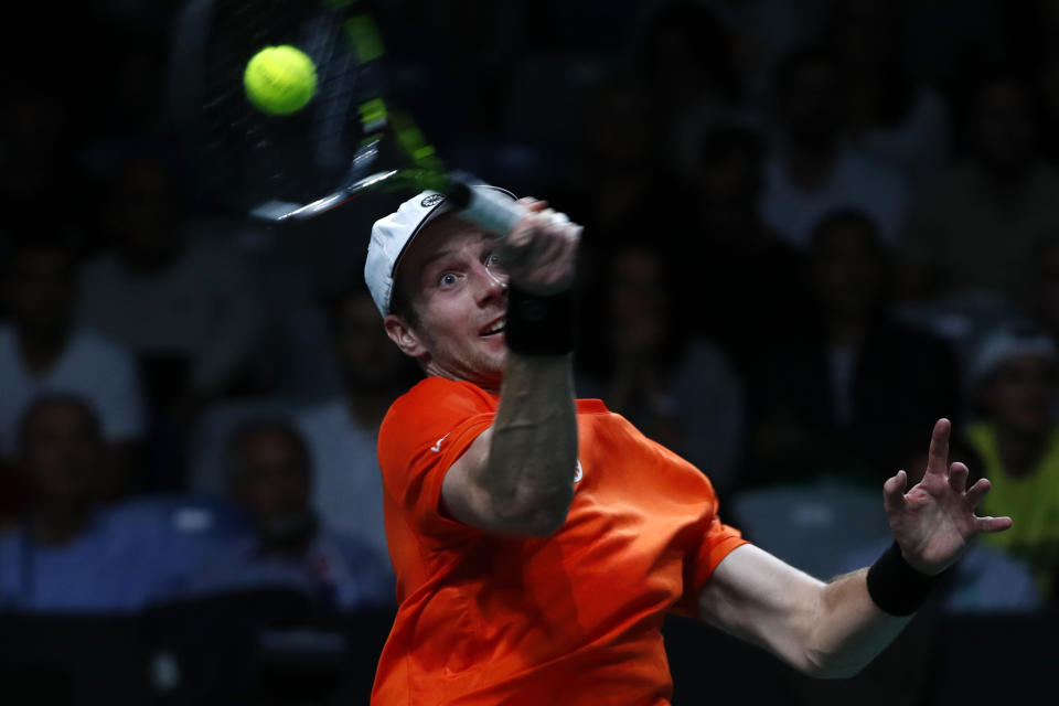 Netherland's Botic van de Zandschulp returns the ball to Australia's Alex de Minaur during a Davis Cup quarter-final tennis match between Australia and The Netherlands in Malaga, Spain, Tuesday, Nov. 22, 2022. (AP Photo/Joan Monfort)