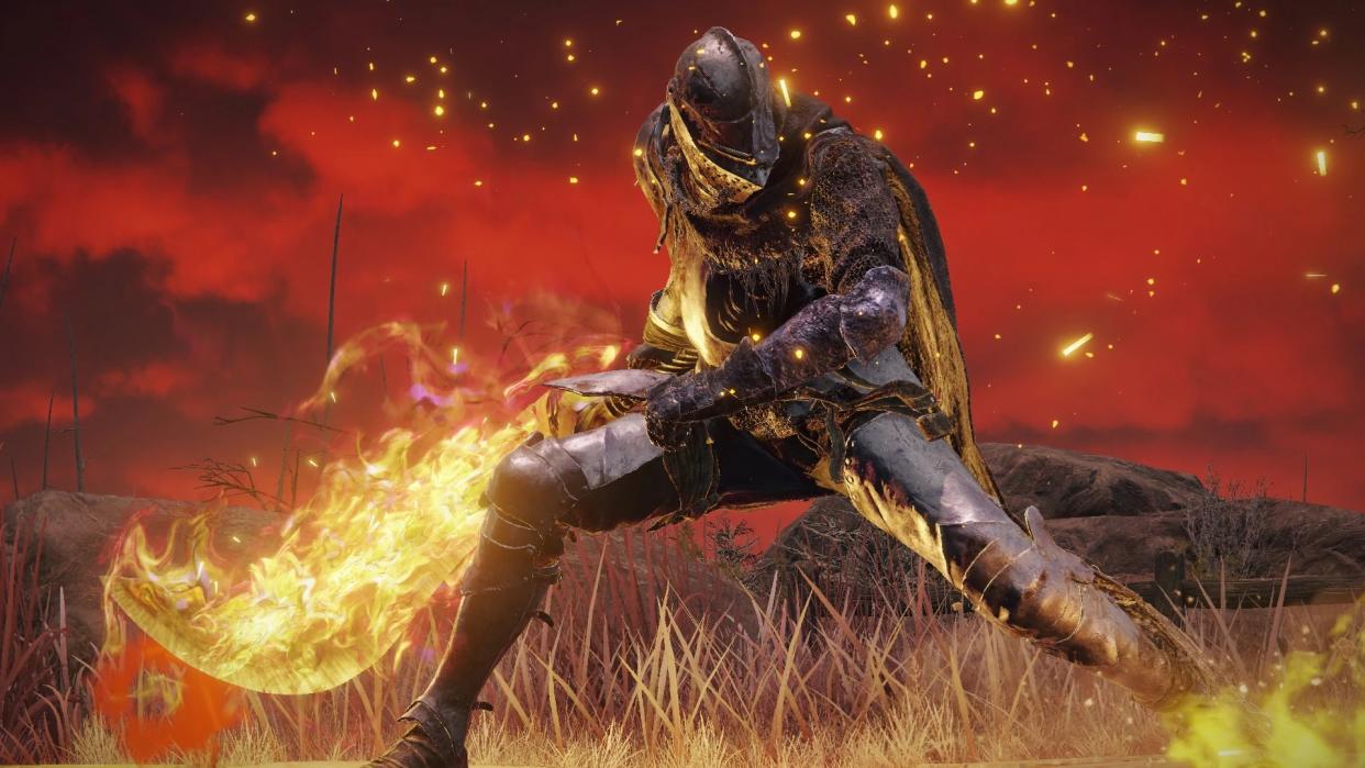  Elden Ring Vyke in front of red sky holding flaming sword in crouched position. 