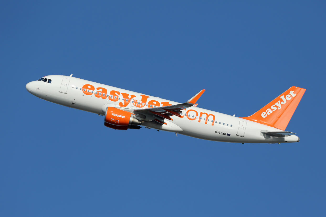 Barcelona, Spain - December 11, 2014: An easyJet Airbus A320 with the registration G-EZWW taking off from Barcelona Airport (BCN). EasyJet is a British low-cost airline with its headquarters near London and some 240 planes in operation.