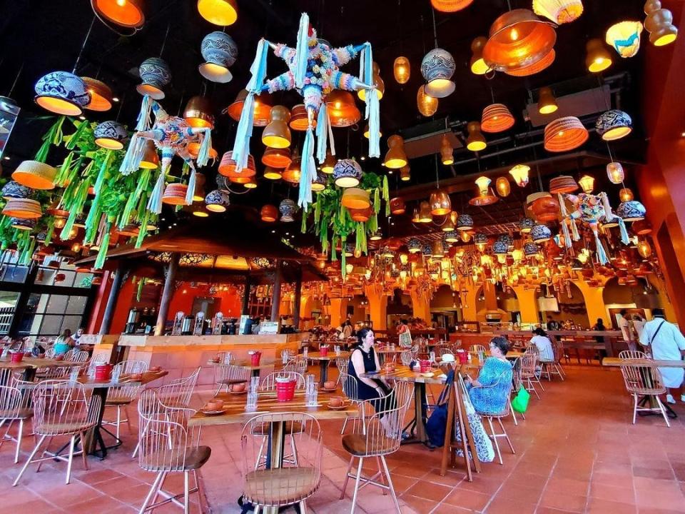 A Mexican-style buffet restaurant with lights and colorful decorations.