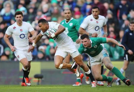 England's Anthony Watson gets past a tackle from Ireland's Robbie Henshaw. Ireland v England - RBS Six Nations Championship 2015 - Aviva Stadium, Dublin, Republic of Ireland - 1/3/15. Action Images via Reuters / Paul Childs Livepic