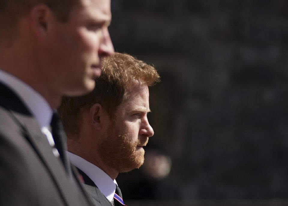ALTERNATIVE CROP VERSION - Britain&#39;s Prince William, Duke of Cambridge, Peter Phillips and Britain&#39;s Prince Harry, Duke of Sussex walk during the funeral procession of Britain&#39;s Prince Philip, Duke of Edinburgh to St George&#39;s Chapel in Windsor Castle in Windsor, west of London, on April 17, 2021. - Philip, who was married to Queen Elizabeth II for 73 years, died on April 9 aged 99 just weeks after a month-long stay in hospital for treatment to a heart condition and an infection. - ALTERNATIVE CROP VERSION (Photo by Victoria Jones / POOL / AFP) / ALTERNATIVE CROP VERSION (Photo by VICTORIA JONES/POOL/AFP via Getty Images)