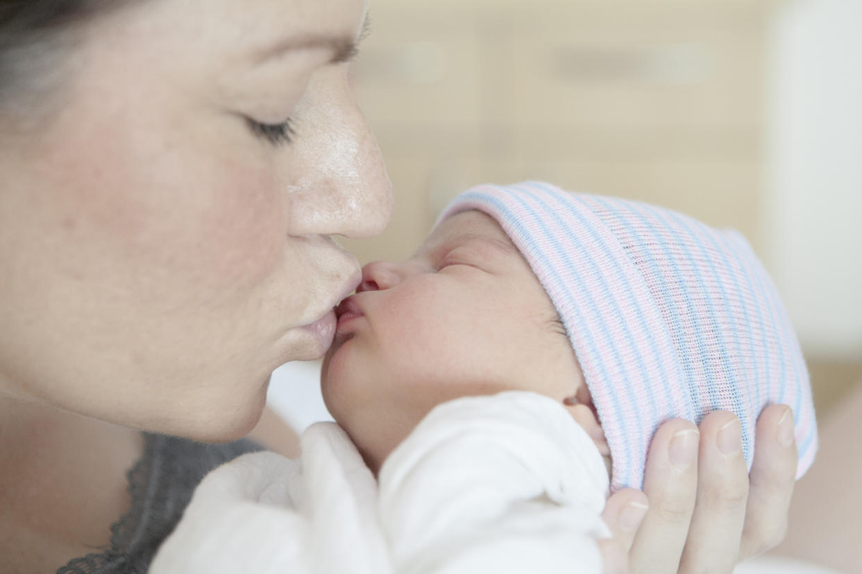 Parents are divided about whether or not it’s ok to stop people kissing your baby [Photo: Getty]