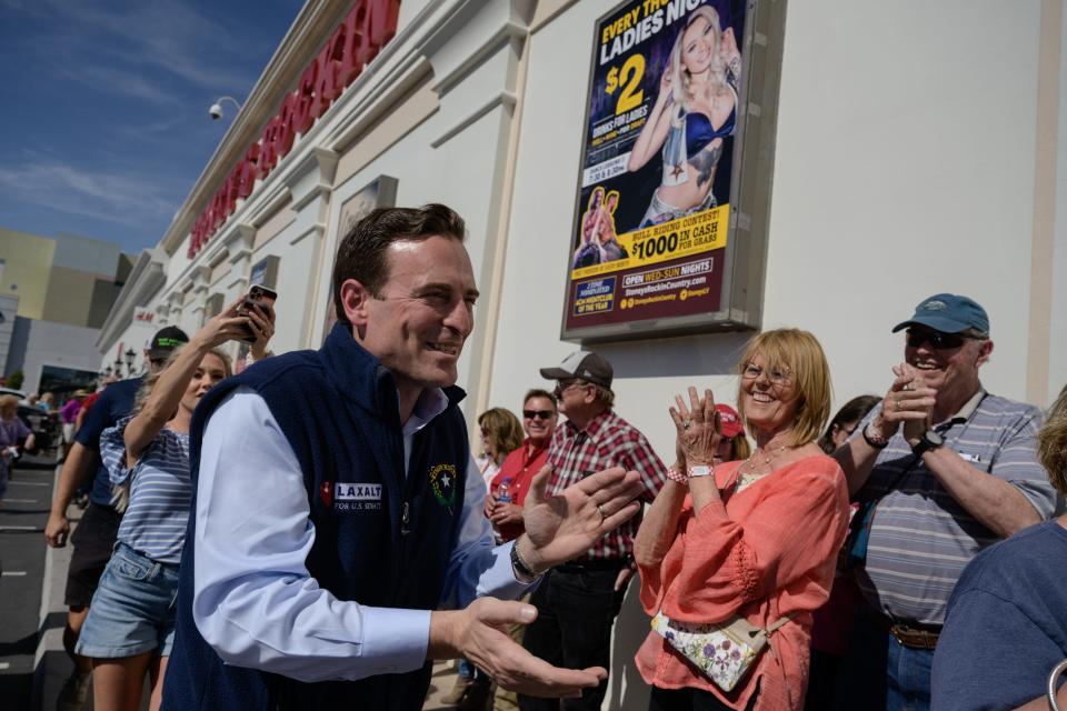 Republican U.S. Senate candidate Adam Laxalt greets attendees outside a rally in Las Vegas, Nevada on April 27, 2022.