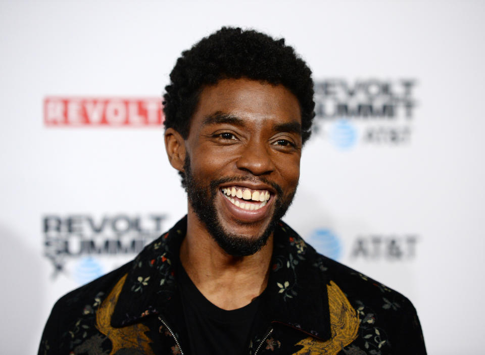 Chadwick Boseman at an event, smiling