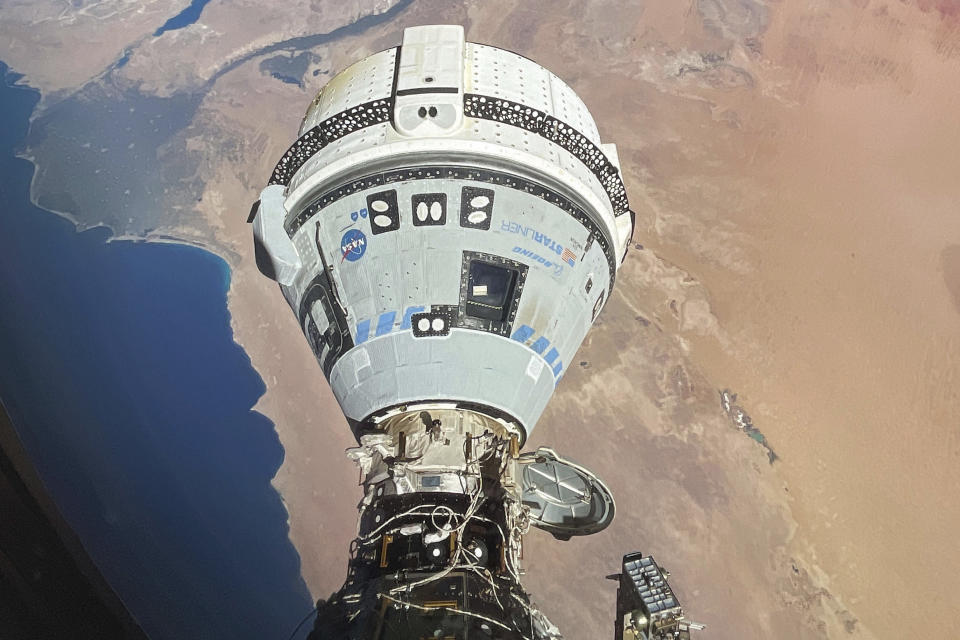 This photo provided by NASA shows the Starliner spacecraft docked to the Harmony module of the International Space Station, orbiting 262 miles above Egypt's Mediterranean coast, on June 13, 2024. (NASA via AP)