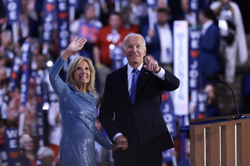 CHICAGO, ILLINOIS - AUGUST 19: First Lady Jill Biden and U.S. President Joe Biden wave to the audience during the first day of the Democratic National Convention at the United Center on August 19, 2024 in Chicago, Illinois.  Delegates, politicians, and Democratic party supporters are in Chicago for the convention, concluding with current Vice President Kamala Harris accepting her party's presidential nomination. The DNC takes place from August 19-22. (Photo by Joe Raedle/Getty Images)