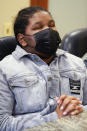 In this Sept. 23, 2021, photo, Roy reacts as he listens to his mother, Domonique Wilson talking during an interview with the Associated Press in Chicago. Royal Smart was handcuffed by police in south Chicago as part of a raid on his home when he was 8 years old and his brother Roy, who is only a year older, stood by watching, not knowing what to say or do. “He’s a child,” Roy said of his sibling. “He wasn’t supposed to be handcuffed like that.” (AP Photo/Nam Y. Huh)