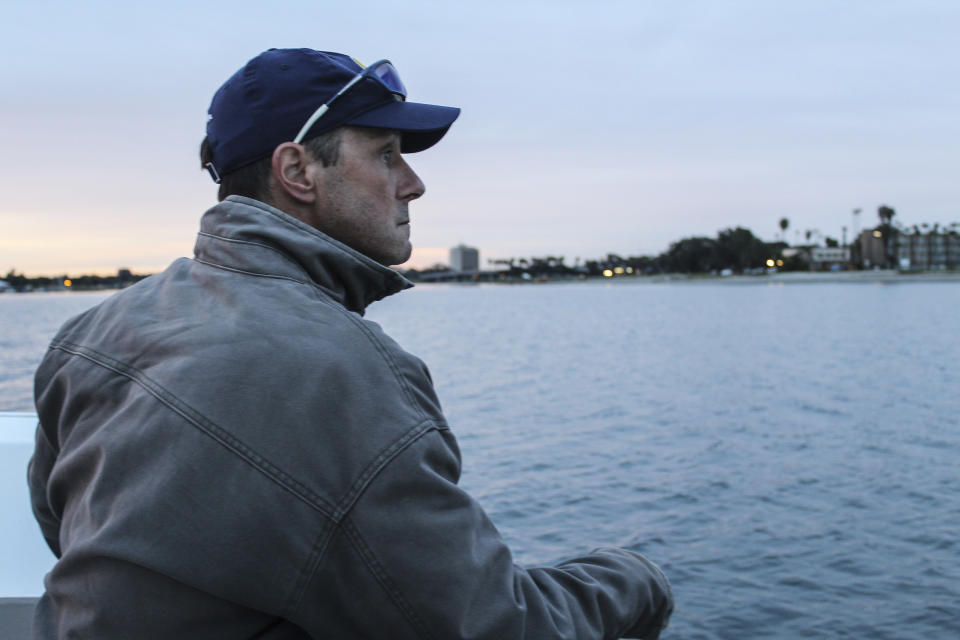 In this February 2020 photo provided by University of California San Diego is men's rowing coach Geoff Bond, during practice in San Diego. Brian Lilly Jr., 19, who committed suicide on Jan. 4, 2021, was a rower at University of California San Diego. Lilly's family has filed a wrongful death lawsuit against the university and the rowing coach, Bond, who is no longer with the school. (University of California San Diego via AP)