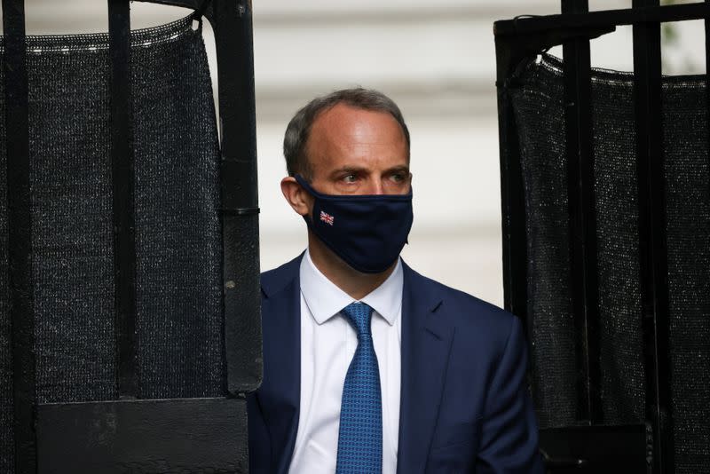 Britain's Foreign Secretary Dominic Raab walks outside Downing Street, in London