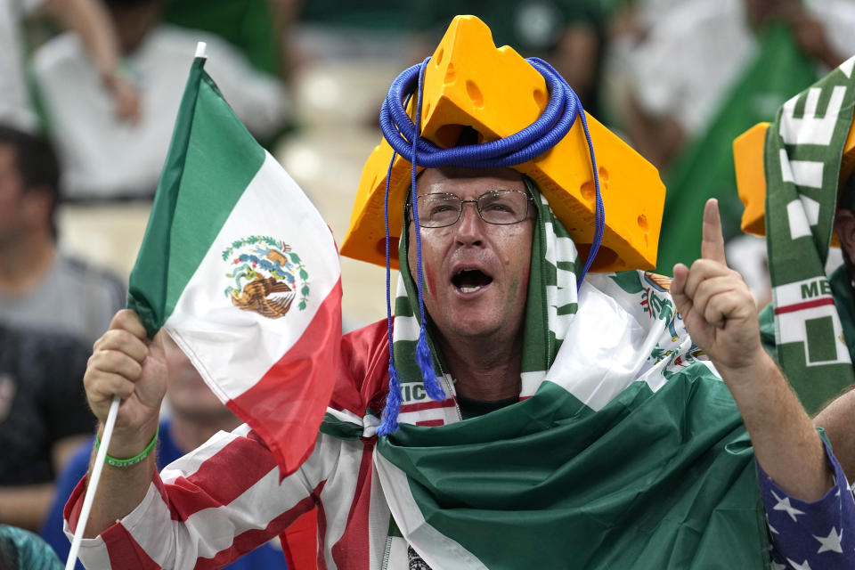 Supporters cheer during the World Cup group C soccer match between Saudi Arabia and Mexico, at the Lusail Stadium in Lusail, Qatar, Wednesday, Nov. 30, 2022. (AP Photo/Ebrahim Noroozi)